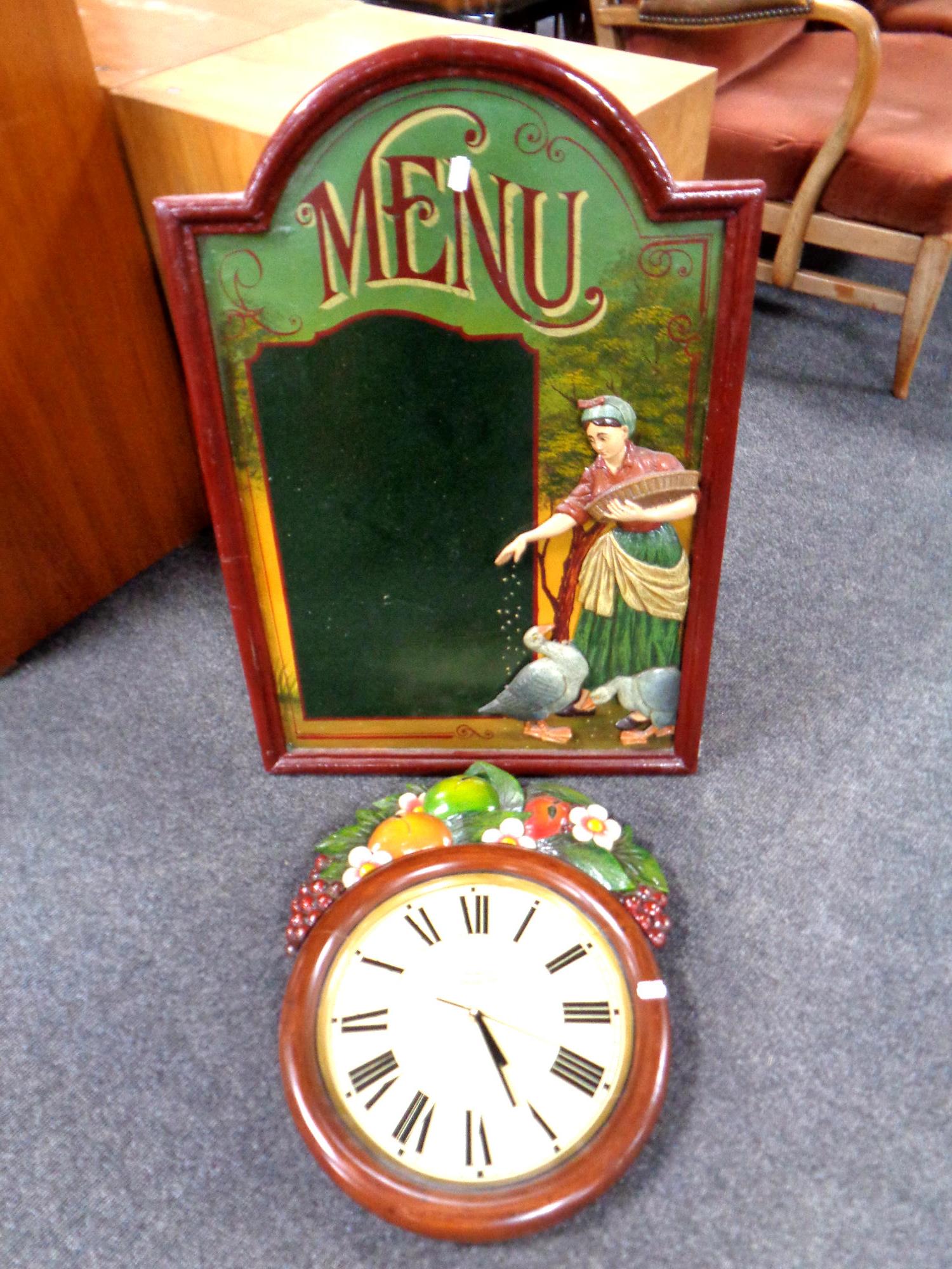 A wooden menu board together with a wooden wall clock