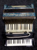 An Italian Frontalini piano accordion together with a Suzuki Melodion