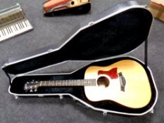 A Taylor electro-acoustic guitar model 110-E in Gator hard carry case