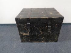 An antique metal bound wooden storage box.