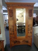 A Victorian walnut mirror door wardrobe with matching dressing table.