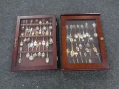 Two display cases containing souvenir spoons.