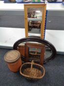 Two mirrors together with a wicker basket, a pine frame and terracotta lidded pot.