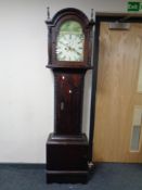 A 19th century pitch pine longcase clock with painted dial.