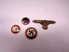 Four German military badges bearing Swastika
