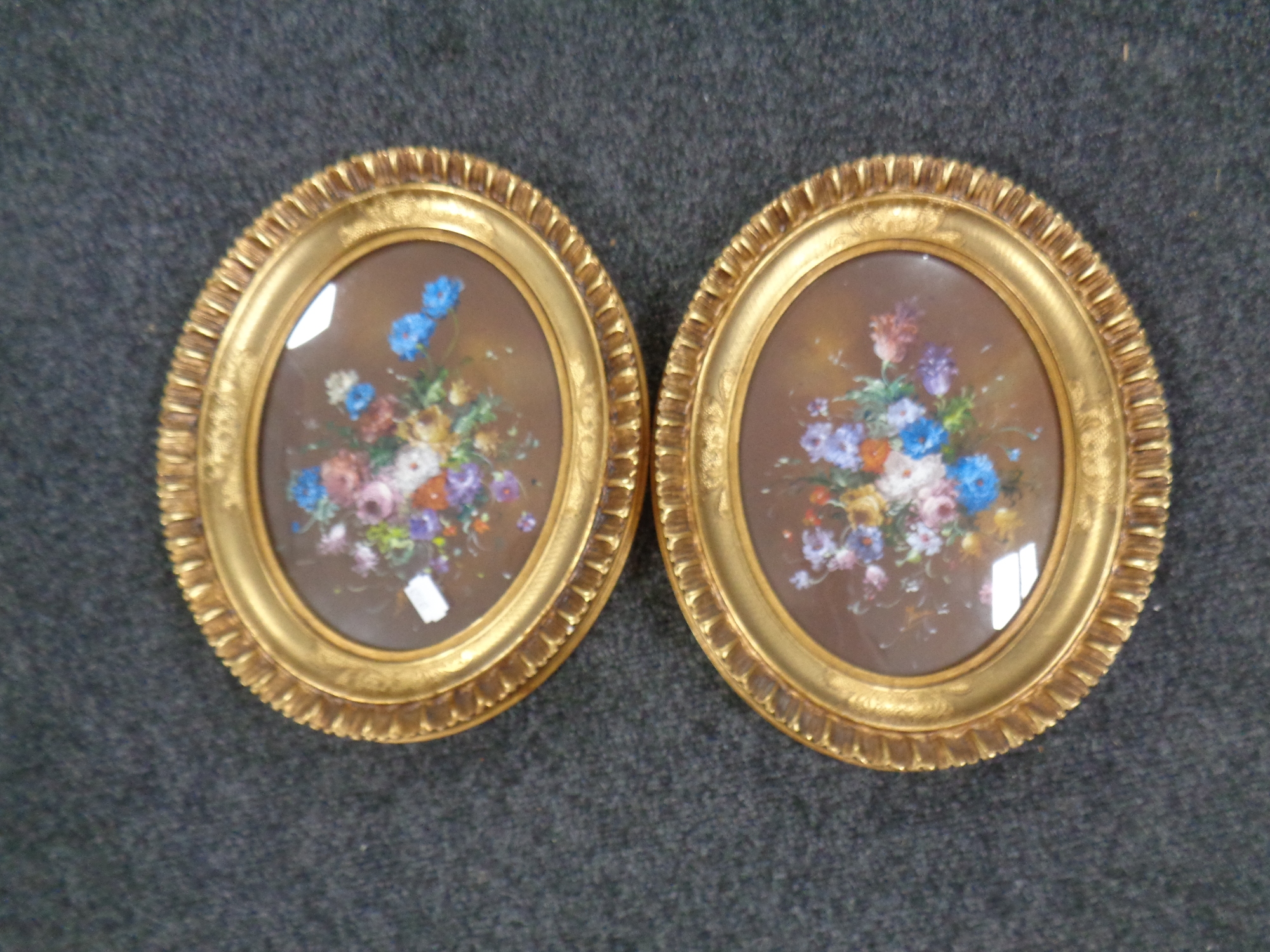 A pair of gilt framed still life oil paintings.