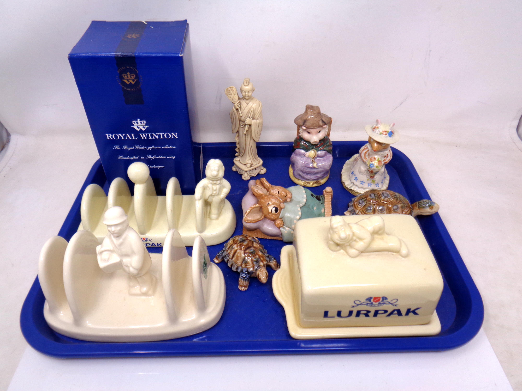 A tray of Lurpak china, Rington's toast rack, butter dish, Pendelfin ornament,