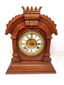 A late Victorian walnut mantel clock.