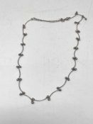 A silver fancy link necklet