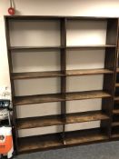 A stained pine open bookcase.