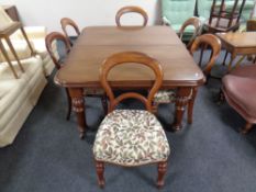 A Victorian mahogany extending dining room table with extra leaf and winding handle,