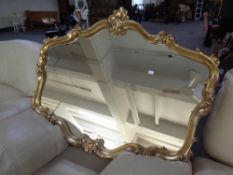 A classical style overmantel mirror.