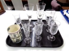 A tray of etched glass champagne flutes, further glass, a Wedgwood William Shakespeare mug.