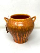 A Pilkingtons Royal Lancastrian twin handled vase decorated in orange lava style glaze,