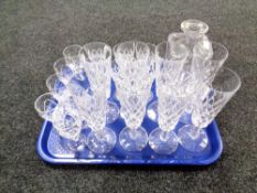 A tray of crystal decanter (no stopper), champagne flutes.