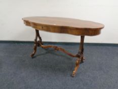 A nineteenth century walnut shaped centre table with a fitted drawer with under stretcher.