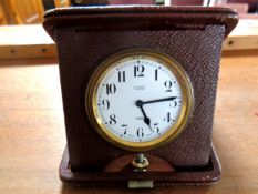 Early twentieth century leather cased travelling alarm clock.