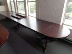 A D-end triple pedestal dining table with two leaves length 574cm