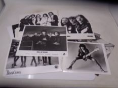 A collection of press release photographs mostly musicians including John Lennon, U2,