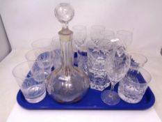 A tray of glass and crystal including a decanter.