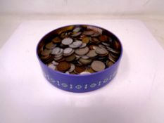 A tin of coins, British coins,