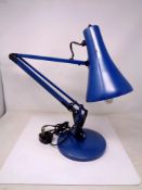 A Herbert Terry angle poise lamp in blue.