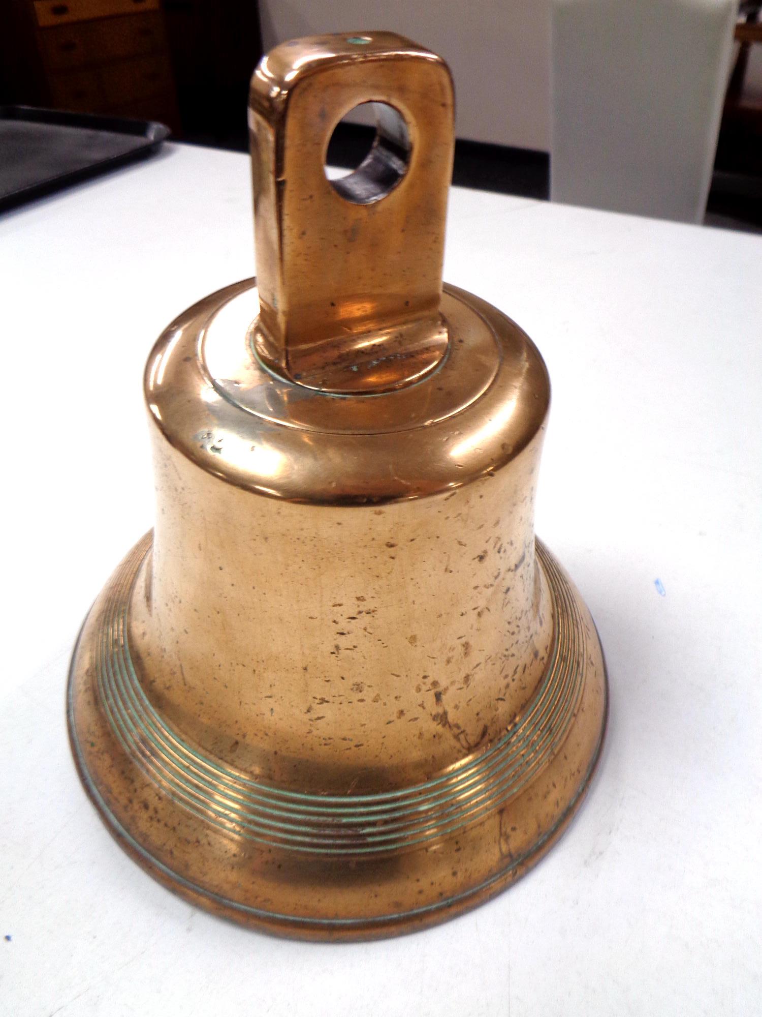 An antique brass bell.