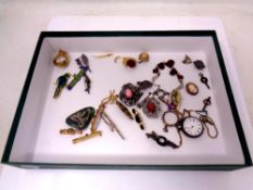 A small quantity of costume jewellery, brooches, continental silver fob watch,