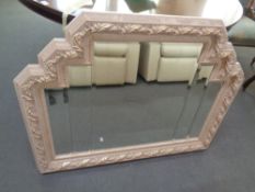 A contemporary Art Deco style mirror with beveled glass.