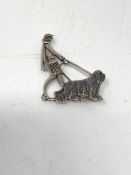 An old silver dog brooch