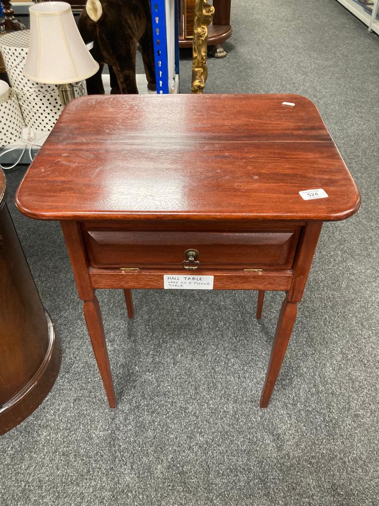 A stained pine side table fitted with a drawer.