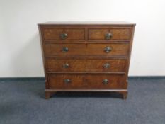 A George III inlaid oak five drawer chest.