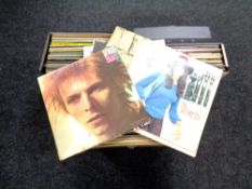 Three cases of vinyl records to include David Bowie, Carly Simon, Peter Gabriel.