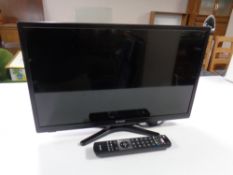 A Linser 24 inch LCD TV with remote control.