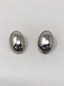 A pair of silver clip earrings