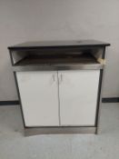 A marble top stainless steel cabinet.