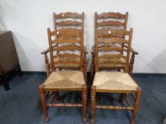 Four antique style country ladder back chairs.