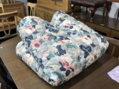 A floral stitched bed throw.