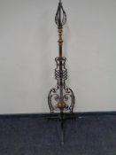 An Arts & Crafts copper and metal floor lamp.