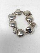 A silver heart shaped bracelet