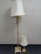 A decorative metal standard lamp with glass drops and shade,