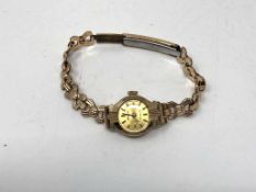 A lady's wristwatch with 9ct gold case on rolled gold bracelet