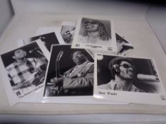 A collection of press release photographs mostly musicians including Stevie Wonder,
