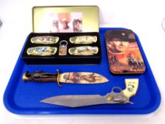 A John Wayne pocket knife collection in tin and further John Wayne collectables