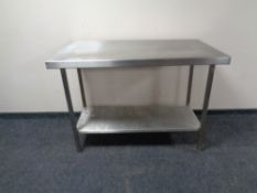 A stainless steel two tier preparation table.