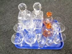 A tray of crystal and glass including pair of decanters.