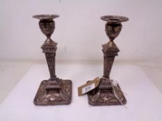 A pair of classical style silver candlesticks