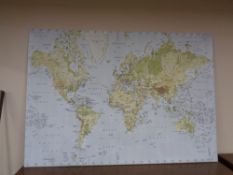 A very large canvas printed map of the world.