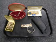 A quantity of costume pearls, gent's wristwatch, collector's knife by Franklin Mint in case.