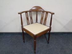 An Edwardian inlaid beech corner chair.
